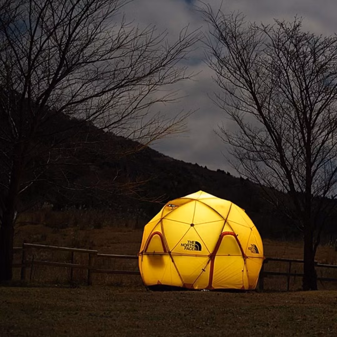 Photo of a yellow domed camping tent structure following face adjacency rules